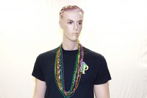 Mannequin wearing mardi gras beads