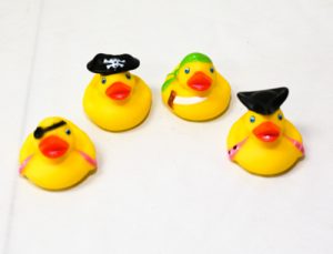 Four rubber ducks dressed as pirates